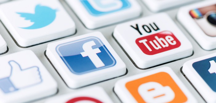 Kiev, Ukraine - May 20, 2013 - A social media logotype collection of well-known social network brand's placed on modern computer keyboard. Include Facebook, YouTube, Twitter, Google Plus, Instagram and more other logos.